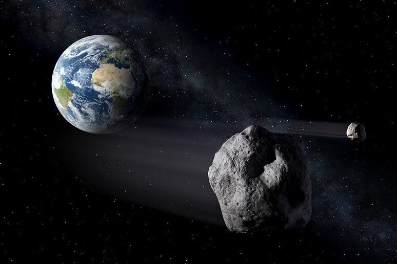 Rappresentazione artistica di due asteroidi vicini alla Terra (fonte: ESA - P.Carril) - RIPRODUZIONE RISERVATA